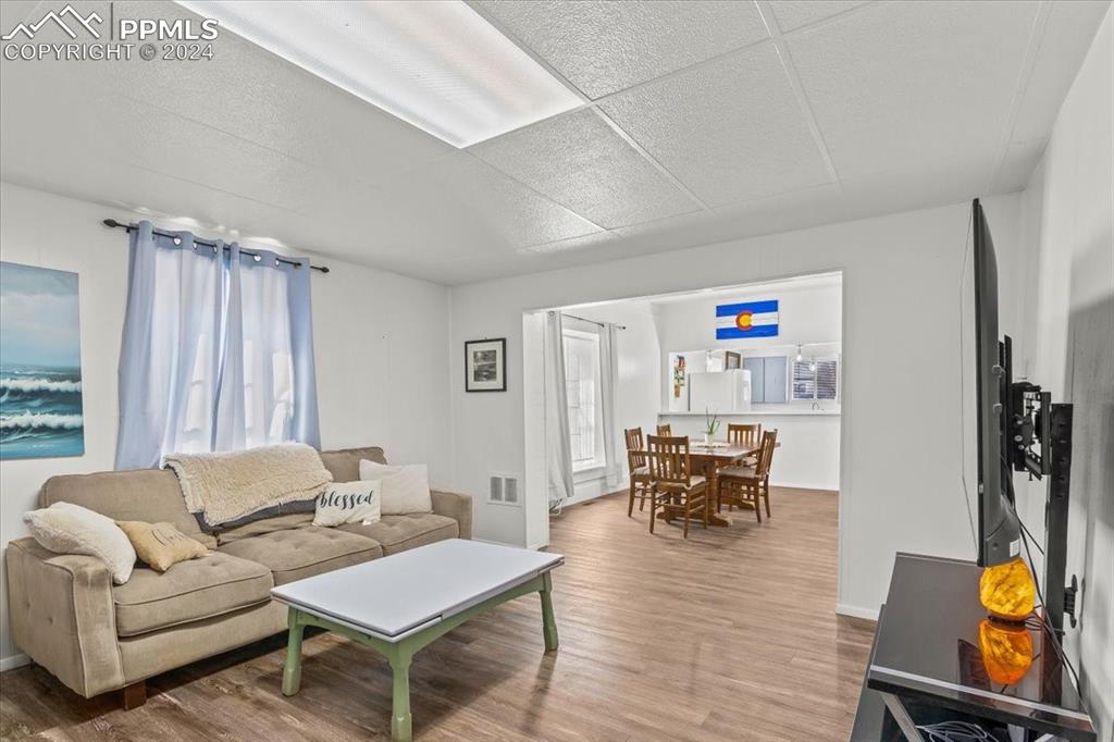 416 Wiley Avenue Swink, CO 81077 - Photo 4 of 43 a living room with furniture and a wooden floor