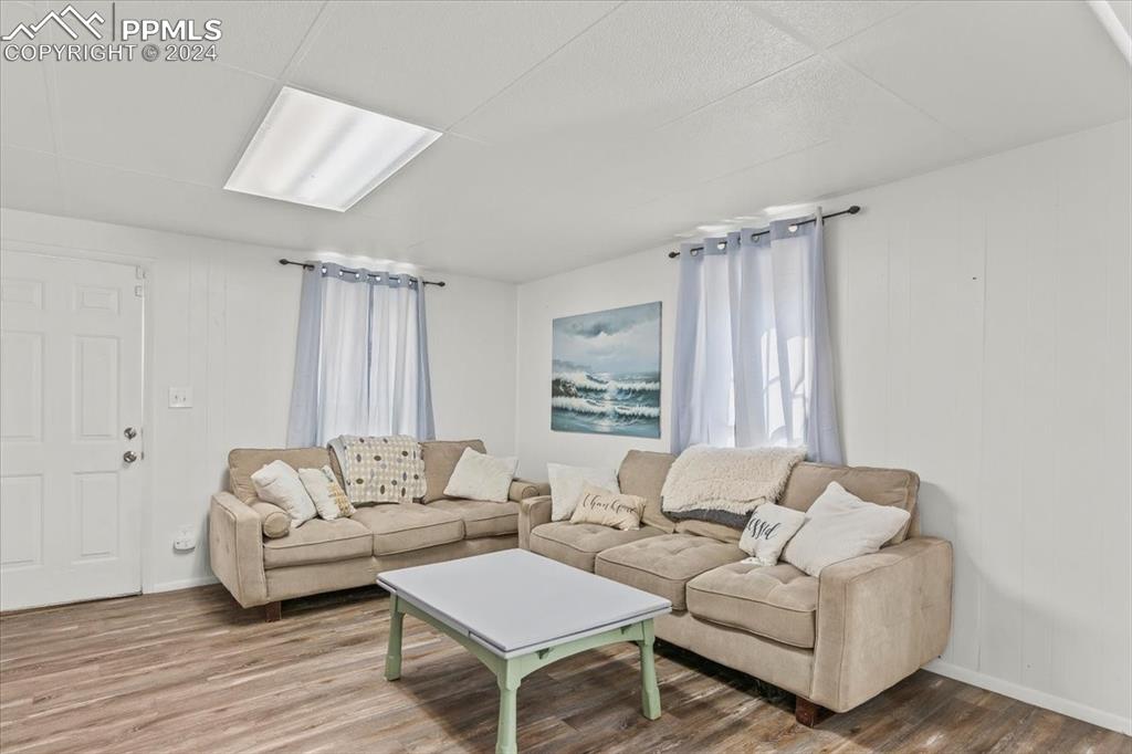 416 Wiley Avenue Swink, CO 81077 - Photo 7 of 43 a living room with furniture and a large window
