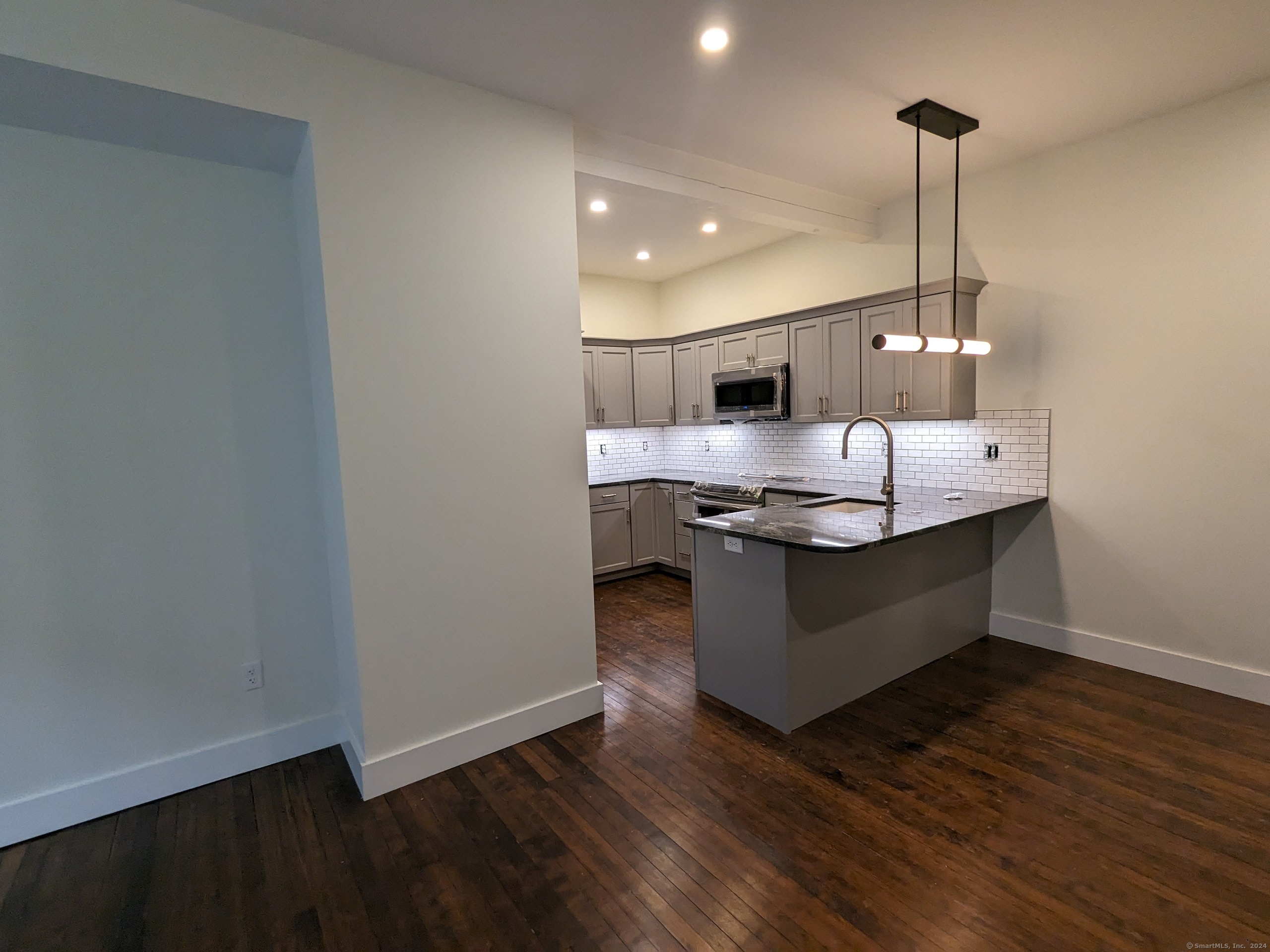 133 Bank Street, Unit 3B New London, CT 06320 - Photo 1 of 1 a dining hall with wooden floor