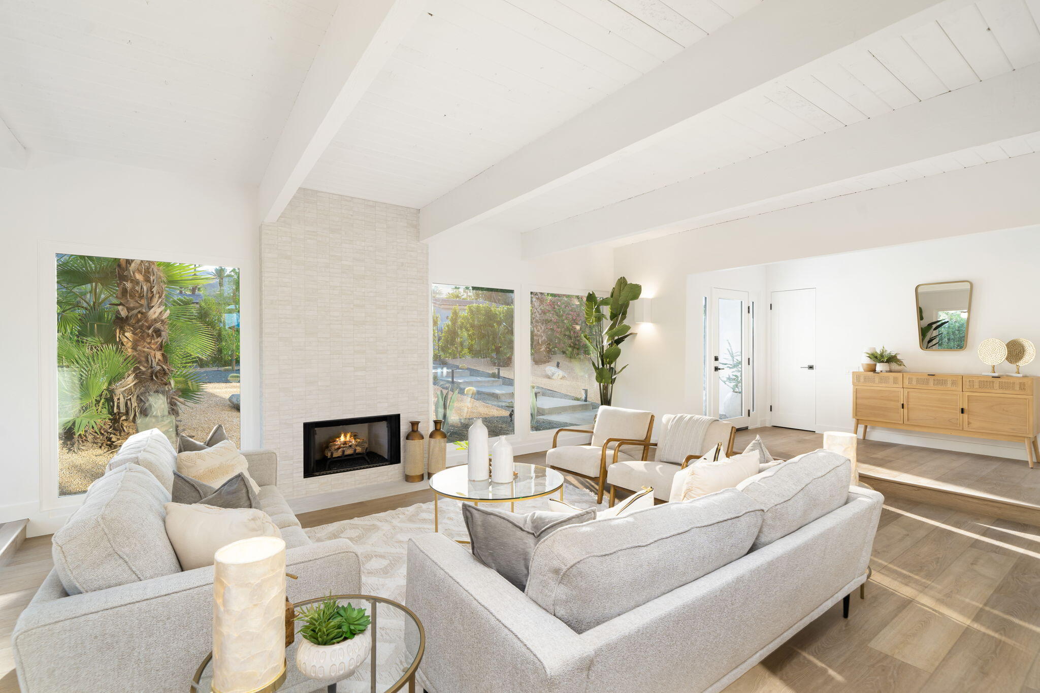71540 Halgar Road Rancho Mirage, CA 92270 - Photo 1 of 51 a living room with furniture and a fireplace