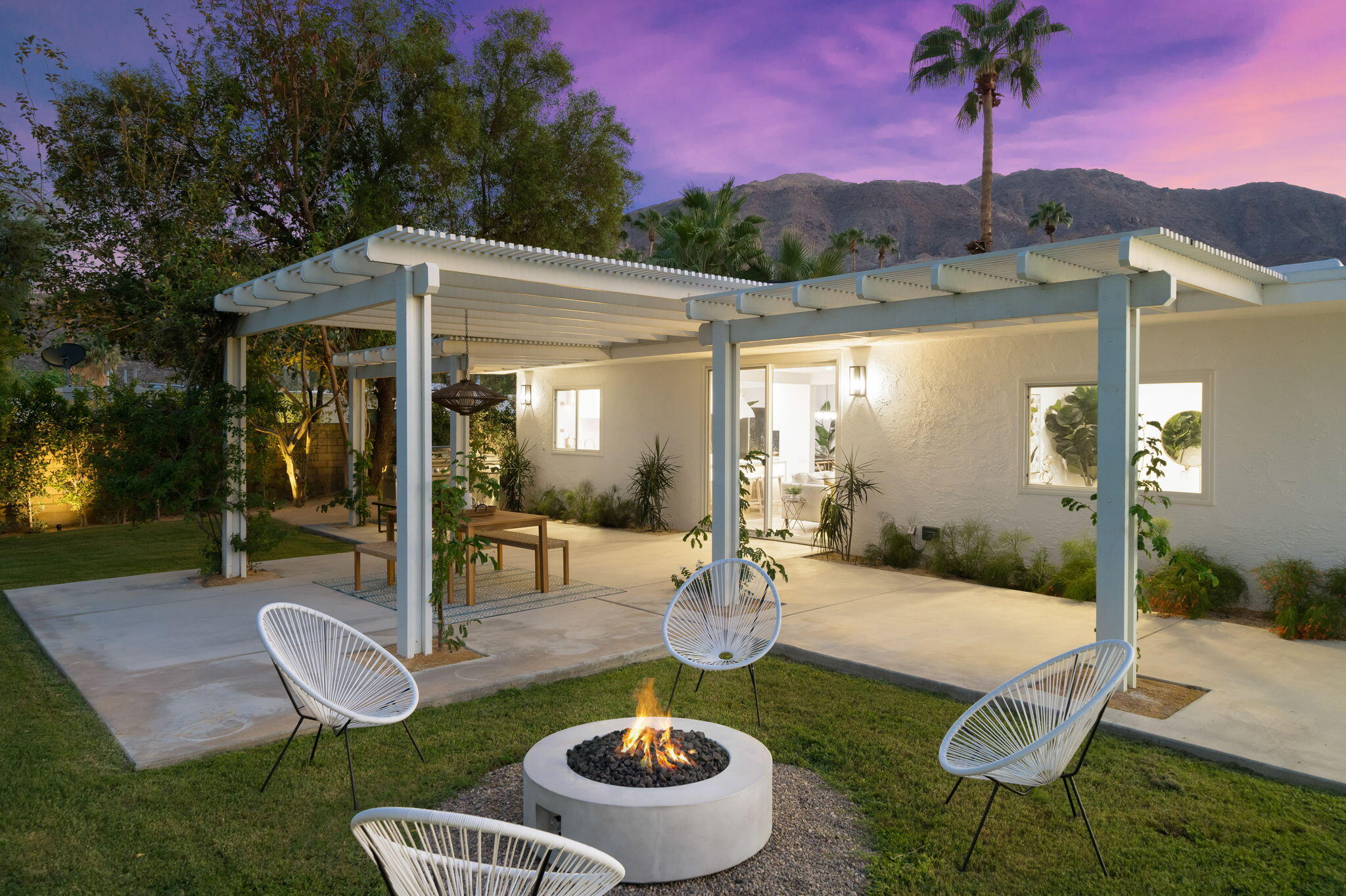 71540 Halgar Road Rancho Mirage, CA 92270 - Photo 19 of 51 a swimming pool with barbeque oven table and chairs