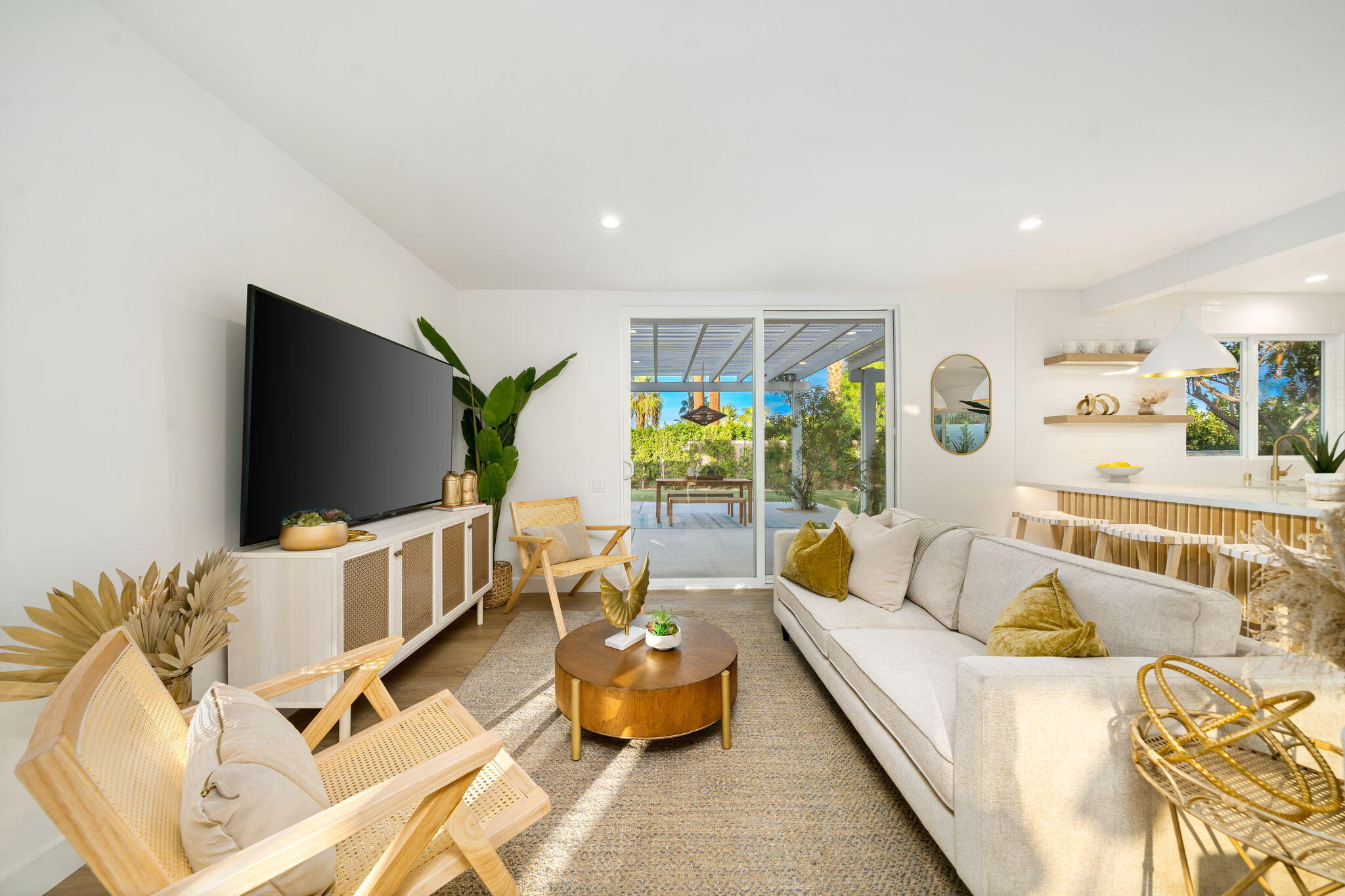 71540 Halgar Road Rancho Mirage, CA 92270 - Photo 25 of 51 a living room with furniture and a flat screen tv