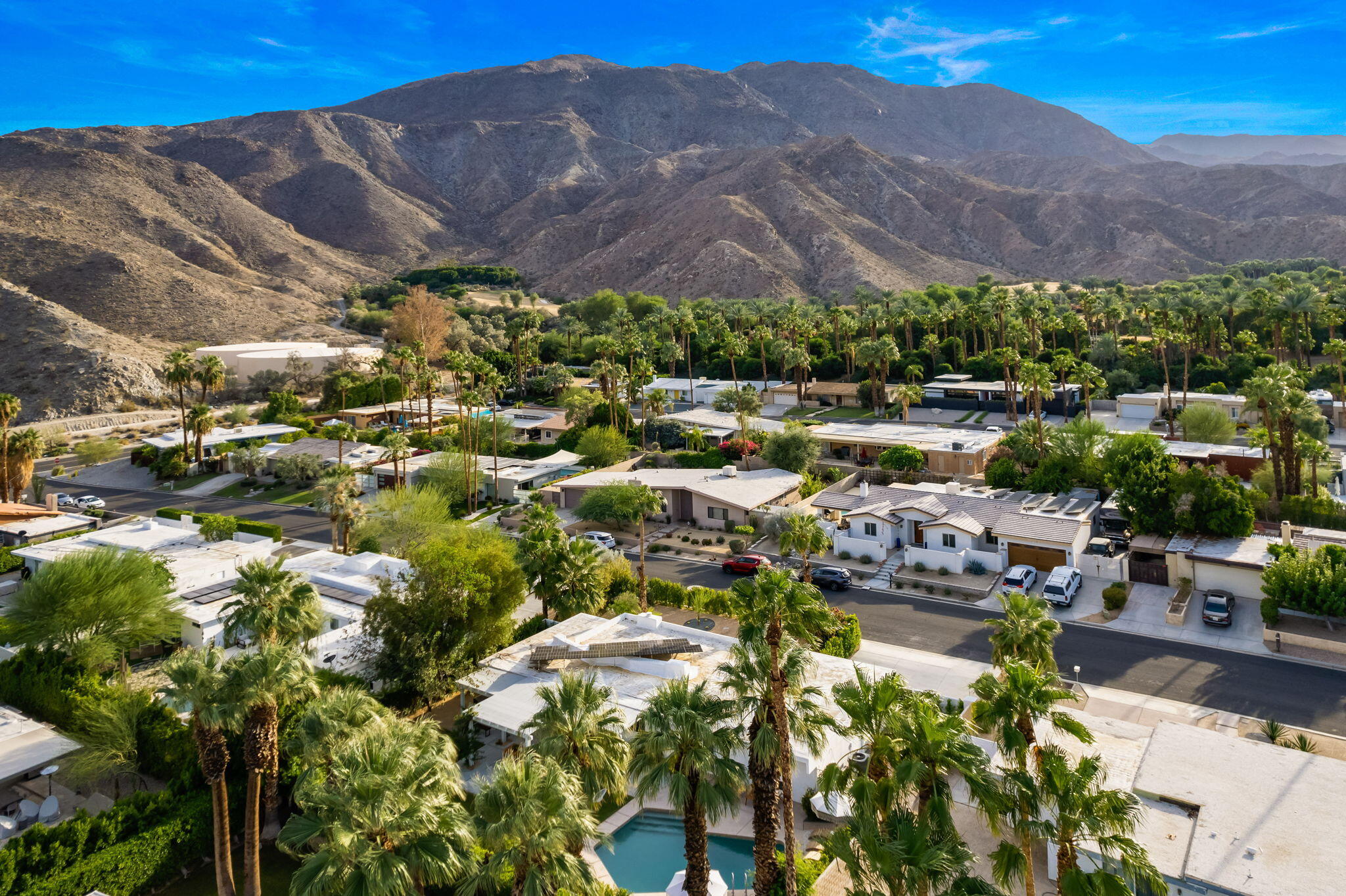 71540 Halgar Road Rancho Mirage, CA 92270 - Photo 40 of 51 a view of a houses with a lush green hillside
