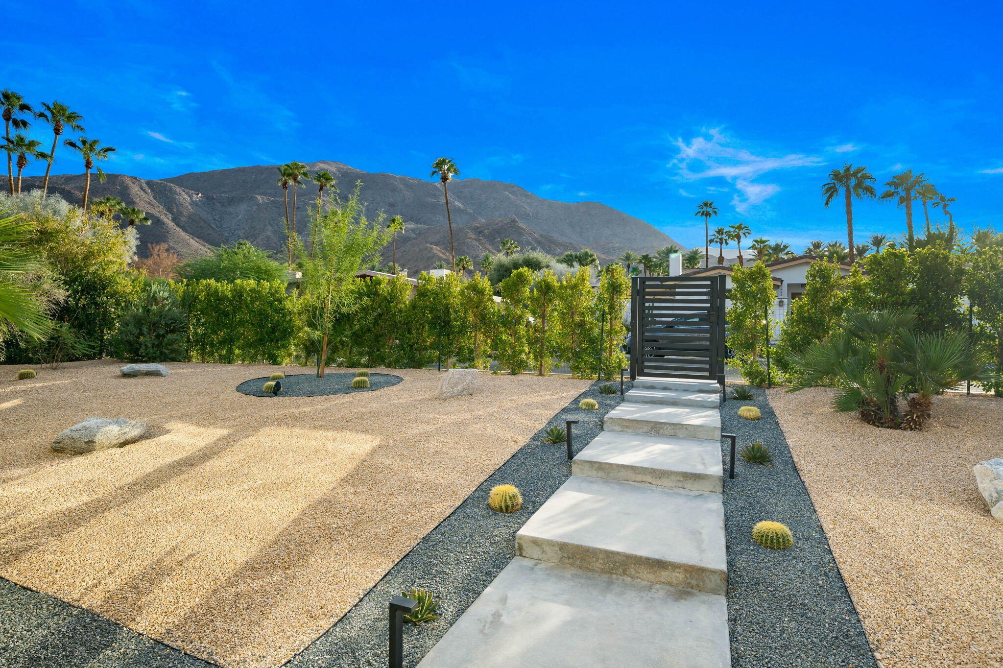 71540 Halgar Road Rancho Mirage, CA 92270 - Photo 45 of 51 a view of a pathway with a wrought fence