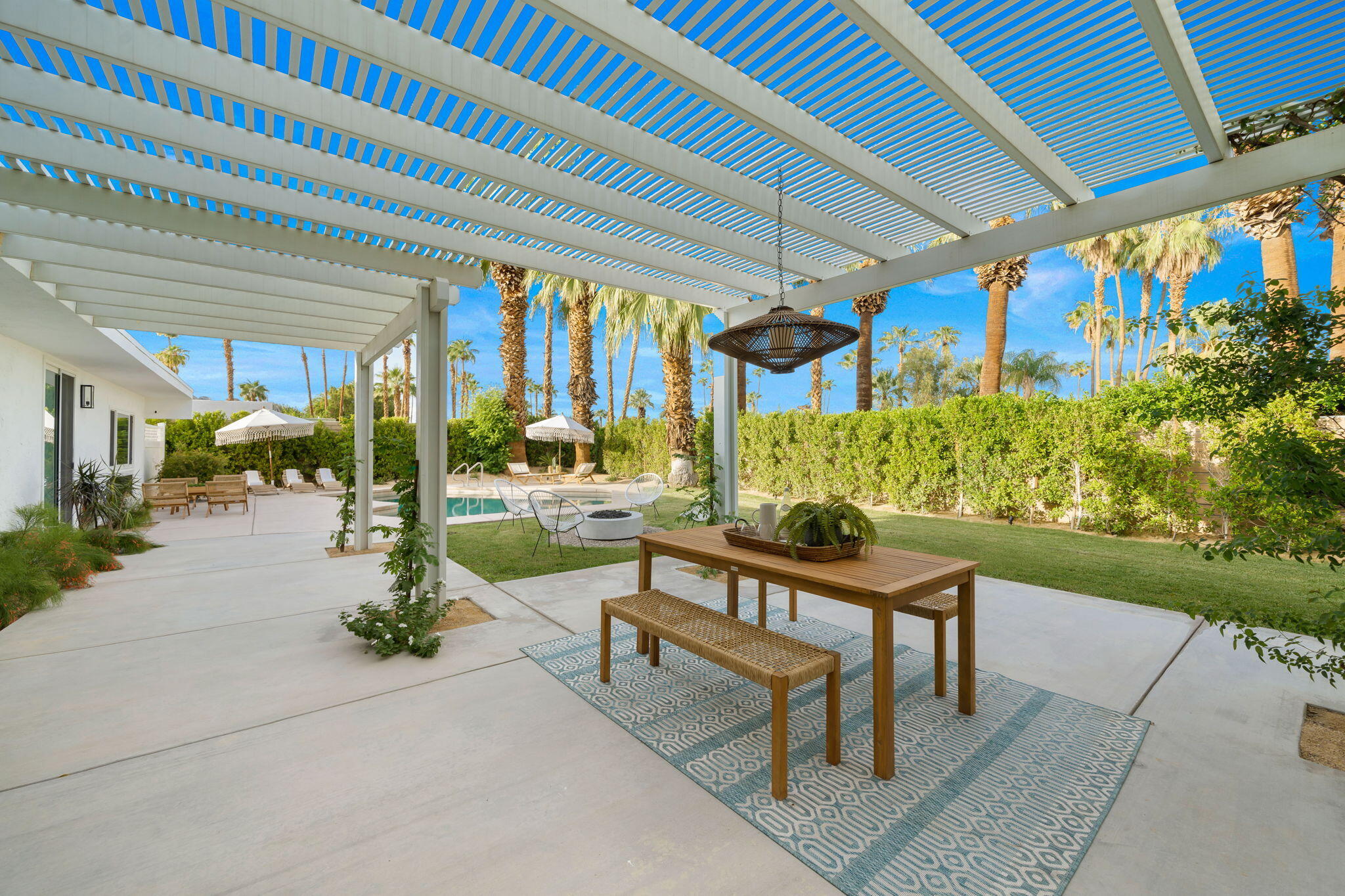 71540 Halgar Road Rancho Mirage, CA 92270 - Photo 47 of 51 a view of a chairs and table in patio with a backyard