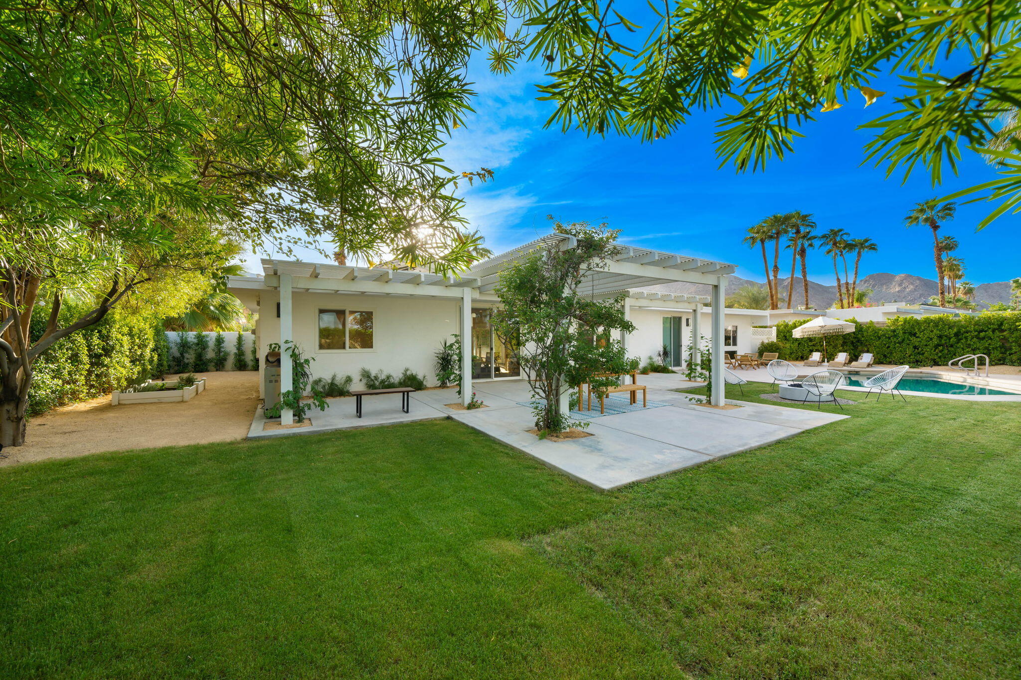 71540 Halgar Road Rancho Mirage, CA 92270 - Photo 48 of 51 a view of a house with a backyard porch and sitting area