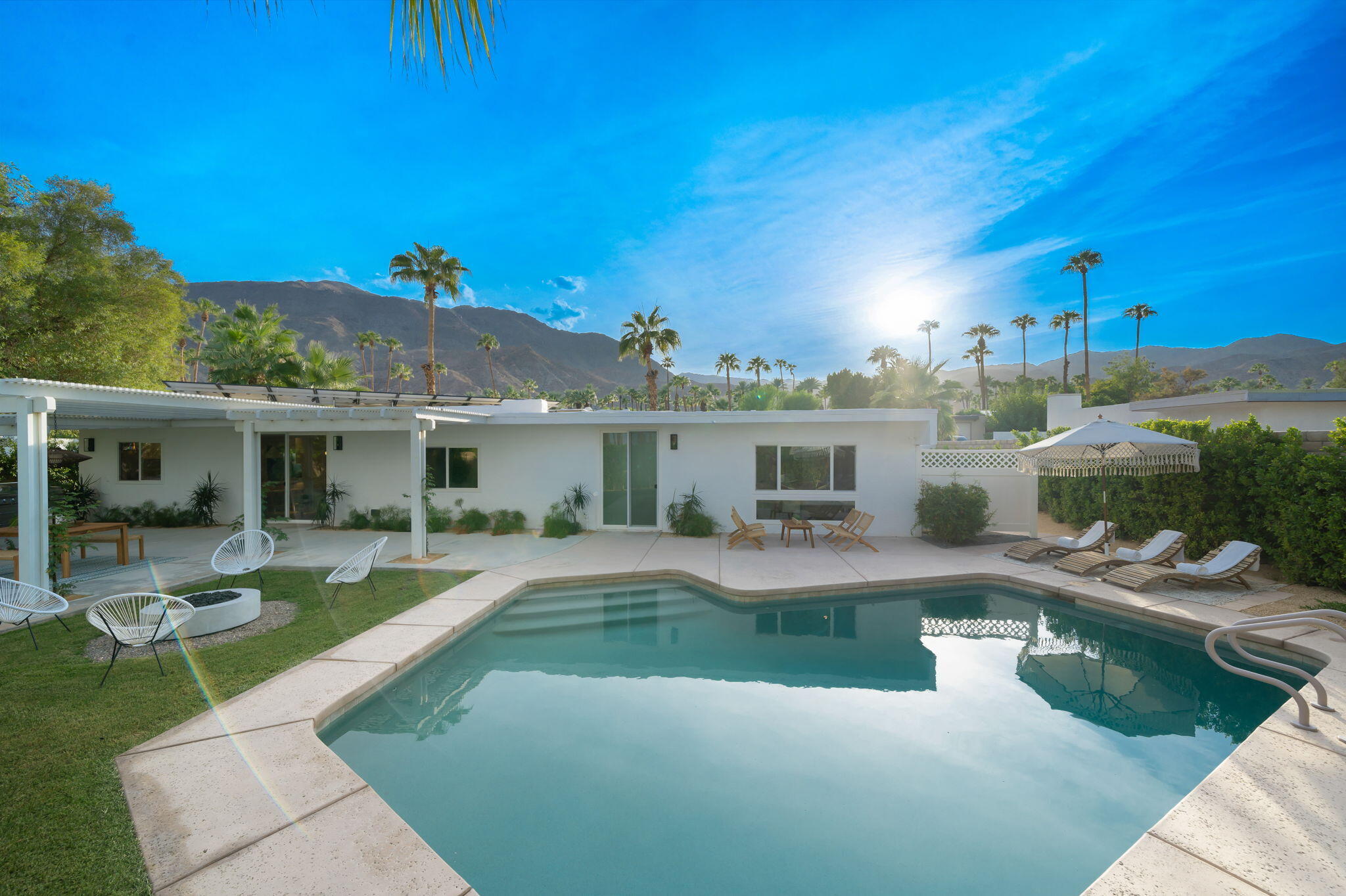 71540 Halgar Road Rancho Mirage, CA 92270 - Photo 51 of 51 a view of a house with swimming pool and sitting area