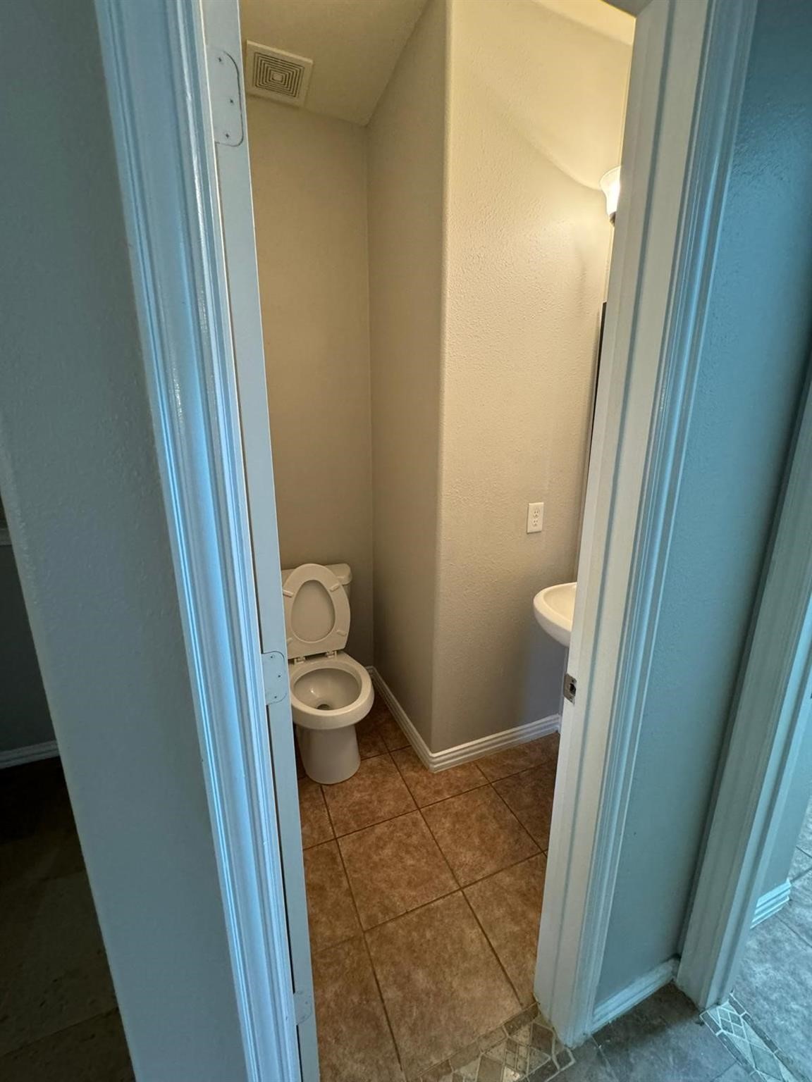25614 Crisp Spring Lane Spring, TX 77373 - Photo 8 of 25 a bathroom with a granite countertop toilet and a sink