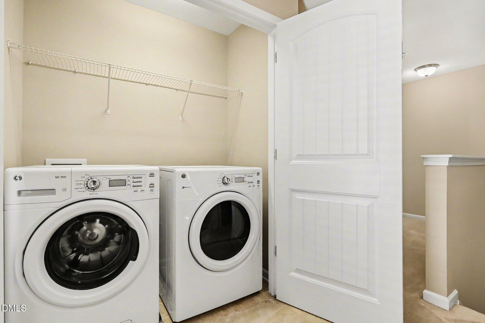 2409 Memory Ridge Drive Raleigh, NC 27606 - Photo 24 of 36 a utility room with dryer and washer