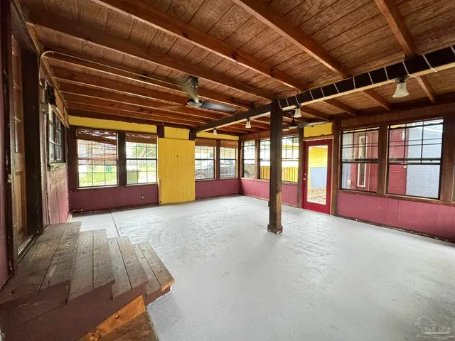 a spacious bedroom with a large bed