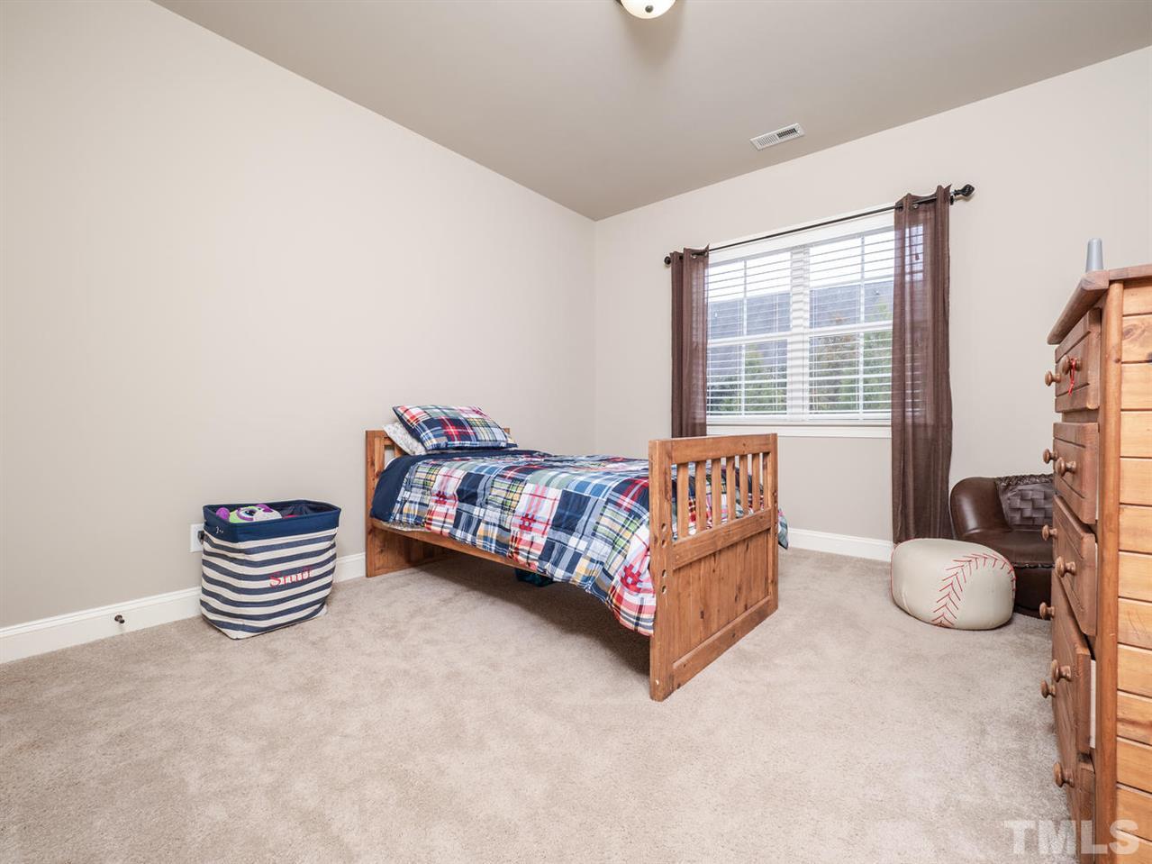 12804 Pegasi Way Raleigh, NC 27614 - Photo 22 of 30 a bedroom with a bed and a window