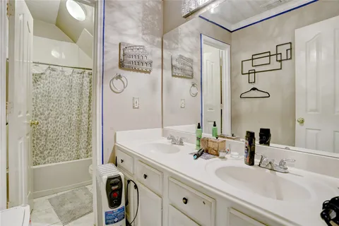 a bathroom with a sink and a mirror a bathtub
