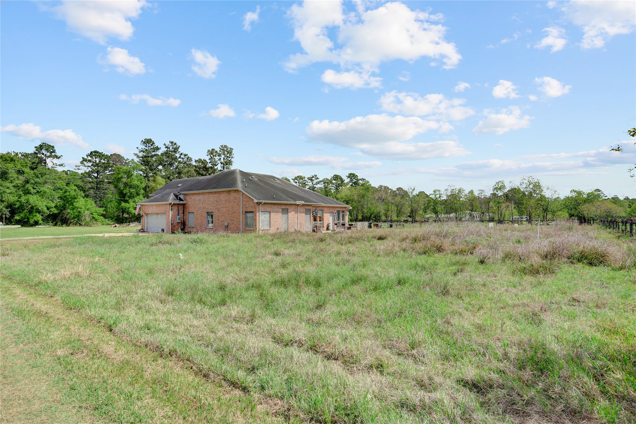 7022 Treaschwig Road Spring, TX 77373 - Photo 16 of 18 a view of a big yard with potted plants and large trees