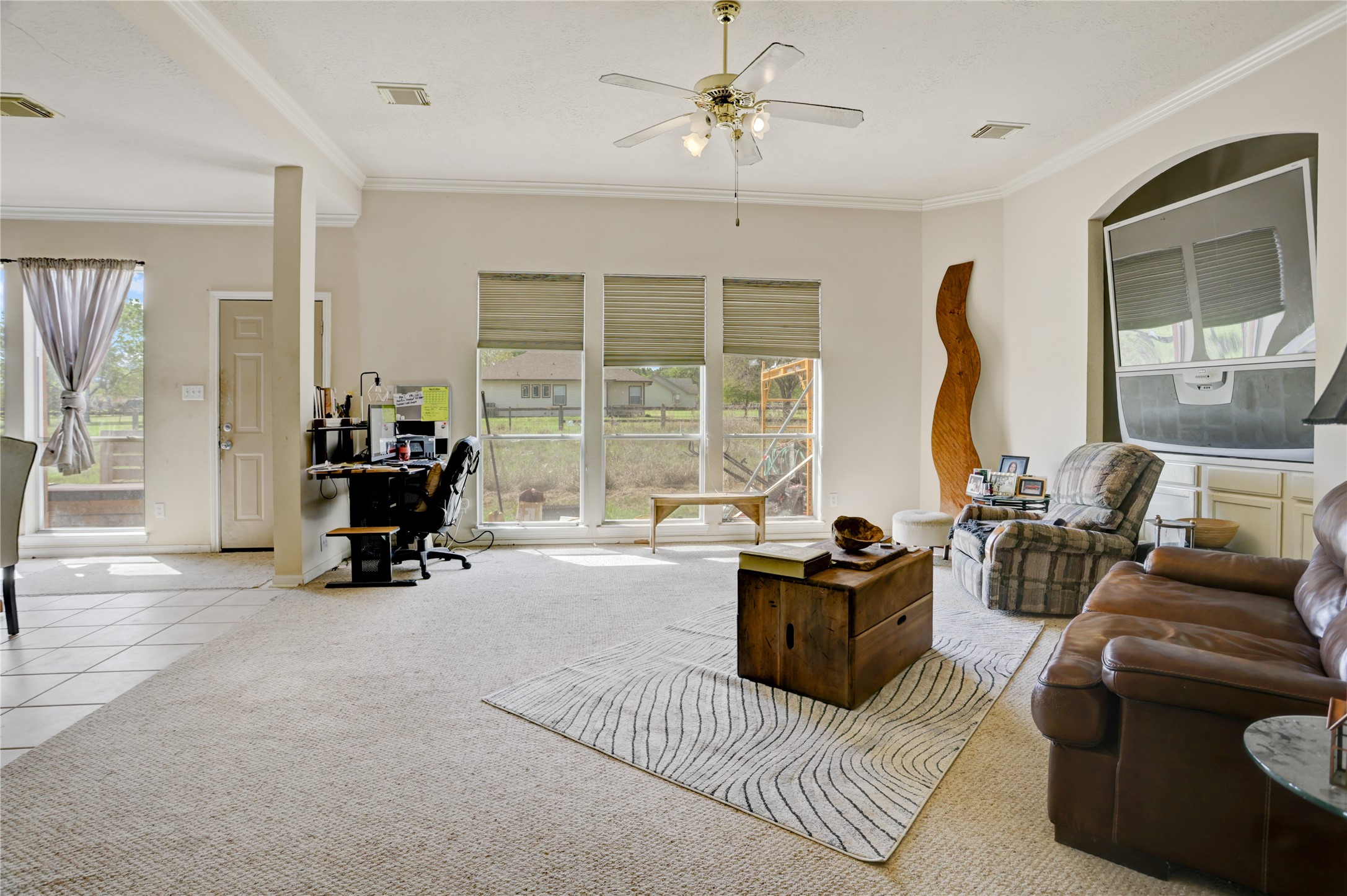 7022 Treaschwig Road Spring, TX 77373 - Photo 7 of 18 a living room with furniture and large windows