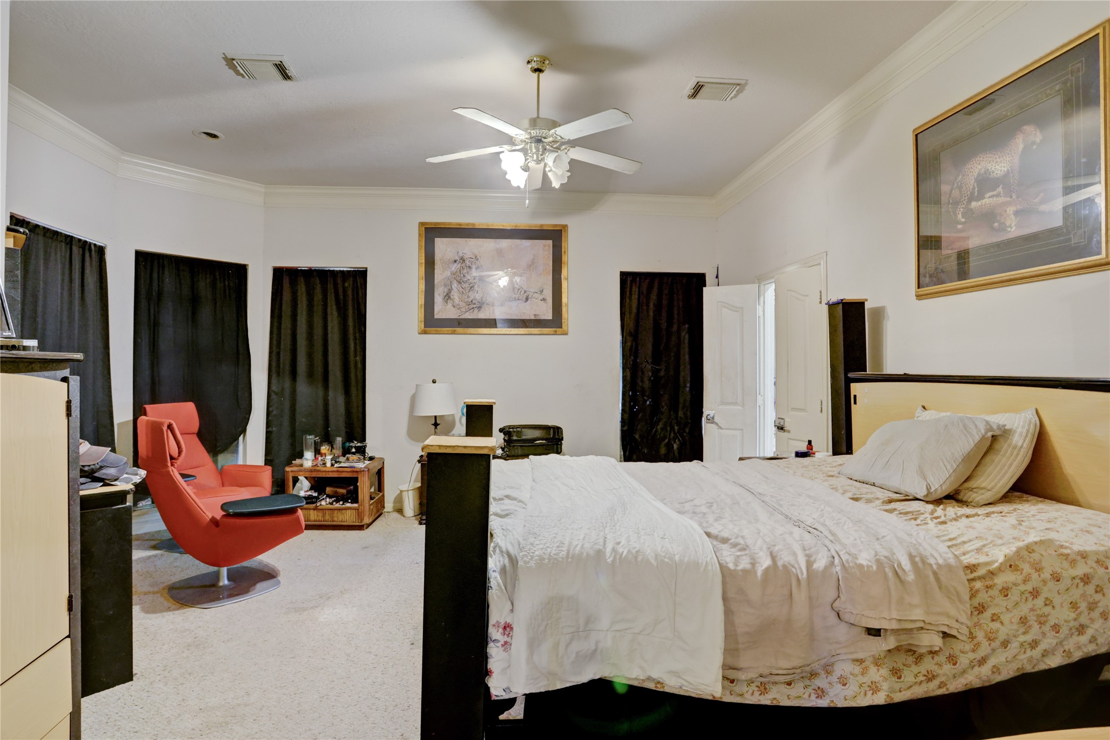 7022 Treaschwig Road Spring, TX 77373 - Photo 9 of 18 a bedroom with a bed and glass walk in closet