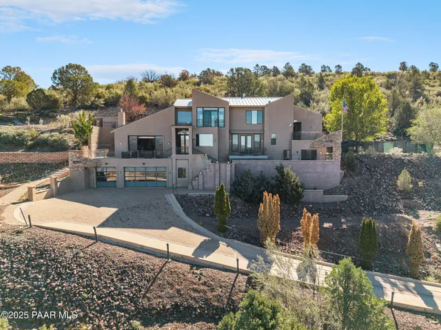 a view of a house with a street