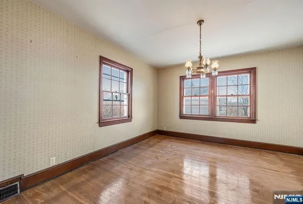 a view of an empty room with windows