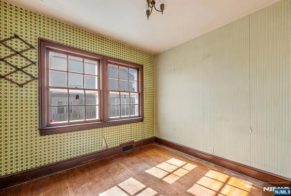 a view of an empty room and a window