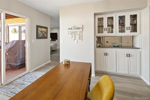 a kitchen with stainless steel appliances white cabinets and a refrigerator