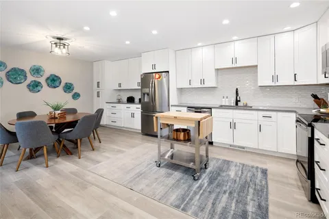 a bathroom with a sink a mirror and toilet