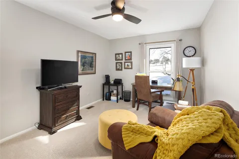 a spacious bedroom with a bed and a couch