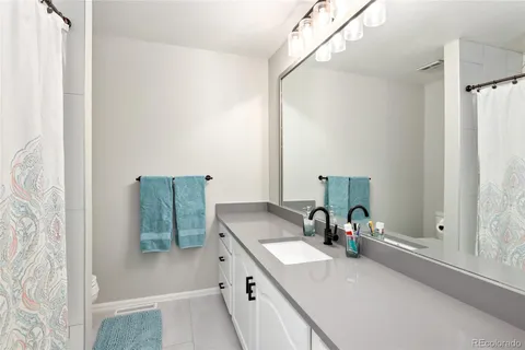 a bathroom with a toilet and shower
