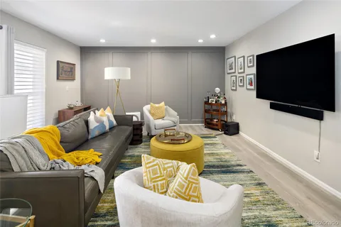 a living room with furniture and a rug