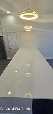 a kitchen with a sink stainless steel appliances and cabinets