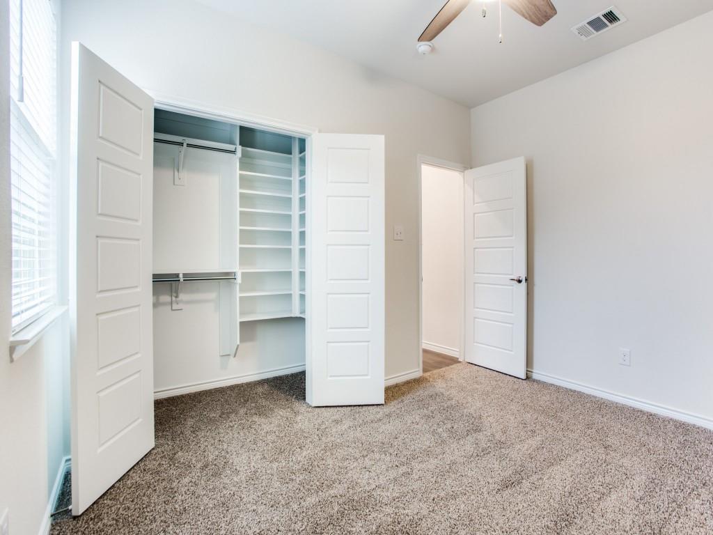 123 Lakeview Circle Pilot Point, TX 76258 - Photo 31 of 39 an empty room with a closet and mirrors