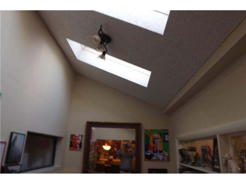16137 Laurel Drive, Unit 32 Weston, FL 33326 - Photo 7 of 9 a black and white kitchen with a sink