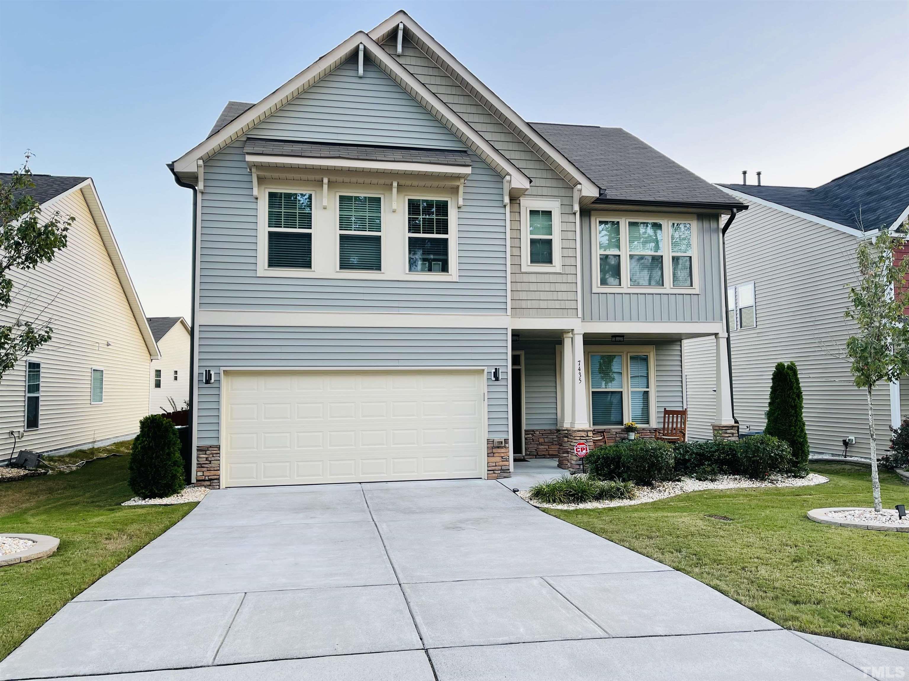 7435 Randshire Way Raleigh, NC 27616 - Photo 2 of 25 a front view of a house with garden