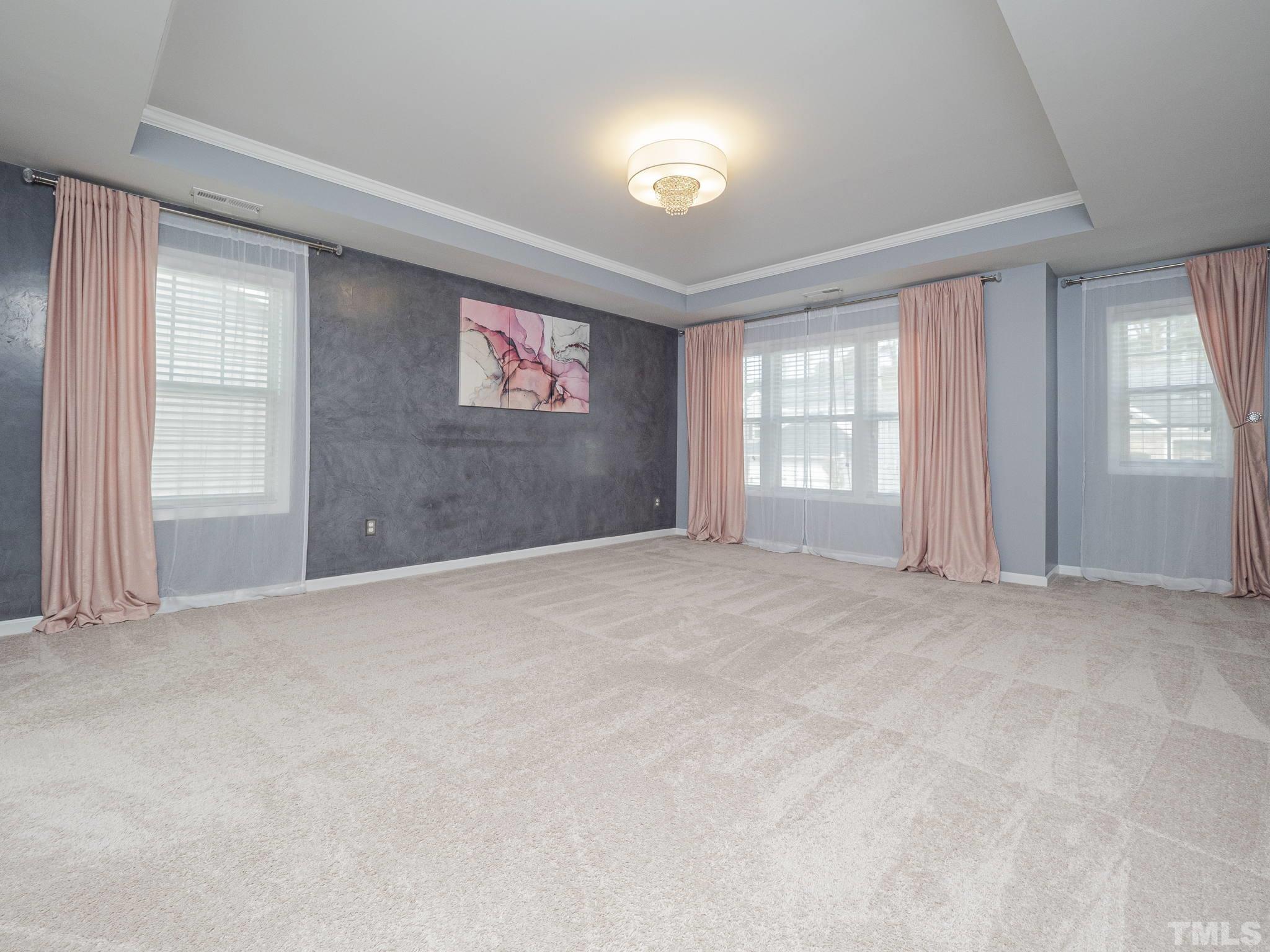 7435 Randshire Way Raleigh, NC 27616 - Photo 12 of 25 an empty room with windows and closet