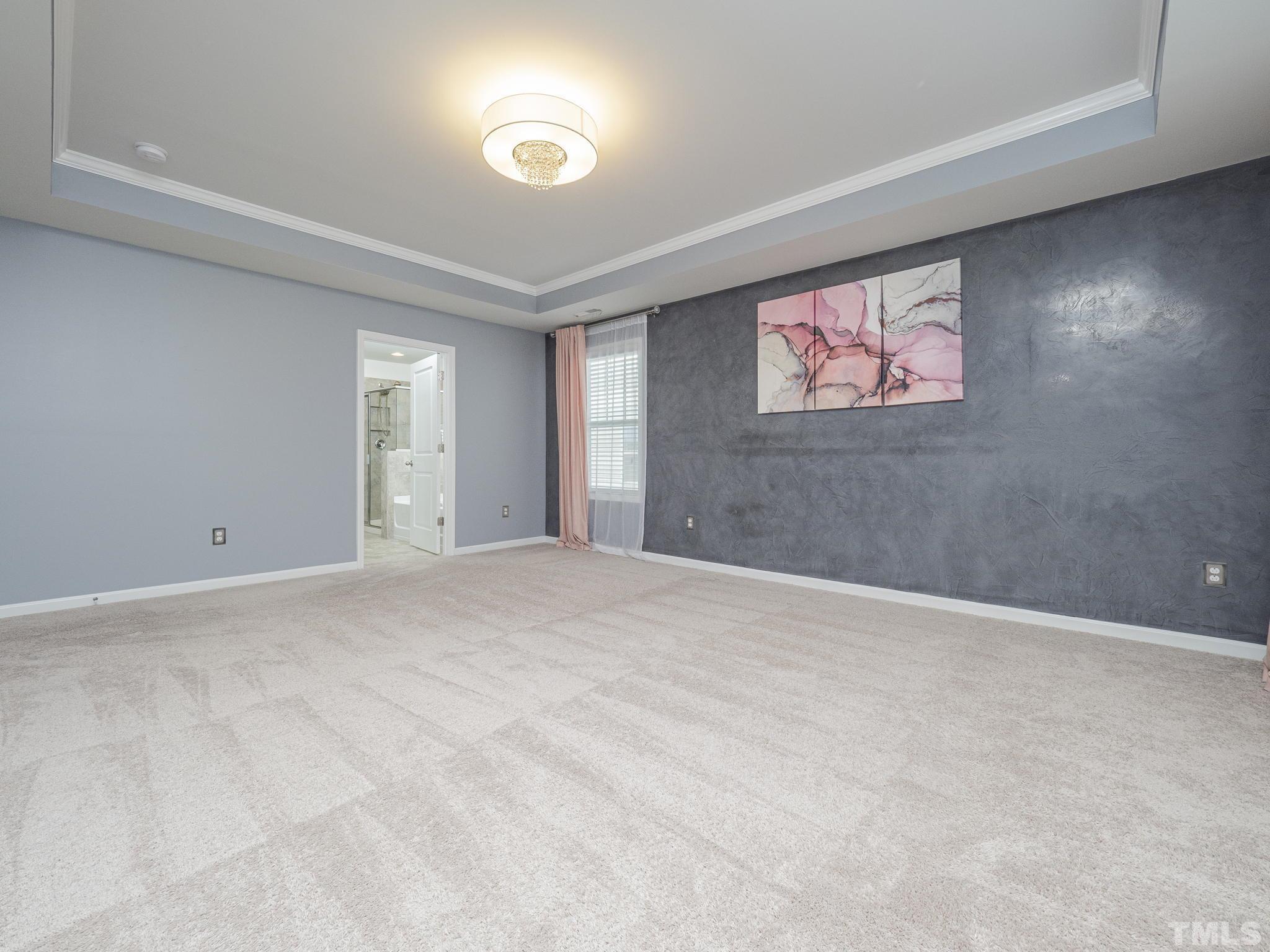 7435 Randshire Way Raleigh, NC 27616 - Photo 13 of 25 a view of an empty room with a window