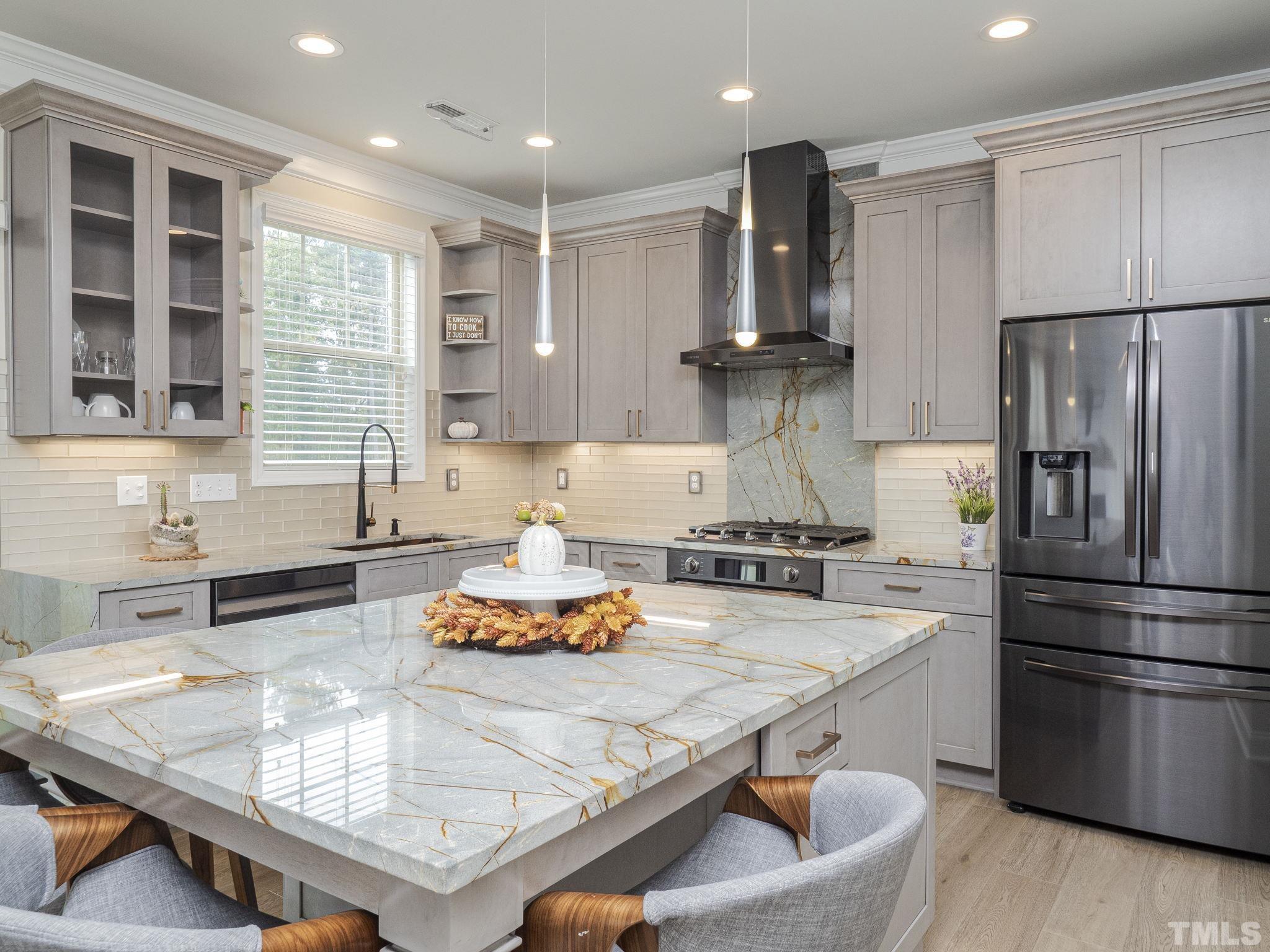7435 Randshire Way Raleigh, NC 27616 - Photo 24 of 25 a kitchen with stainless steel appliances granite countertop a sink stove and refrigerator