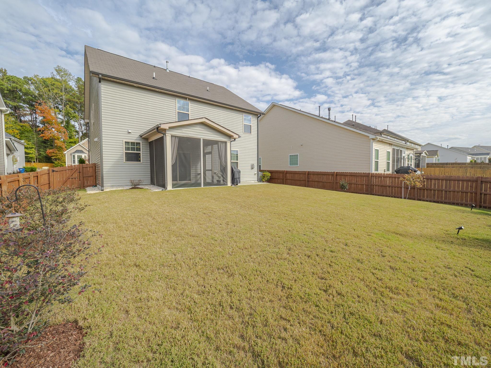 7435 Randshire Way Raleigh, NC 27616 - Photo 25 of 25 a view of a house with a yard and garage
