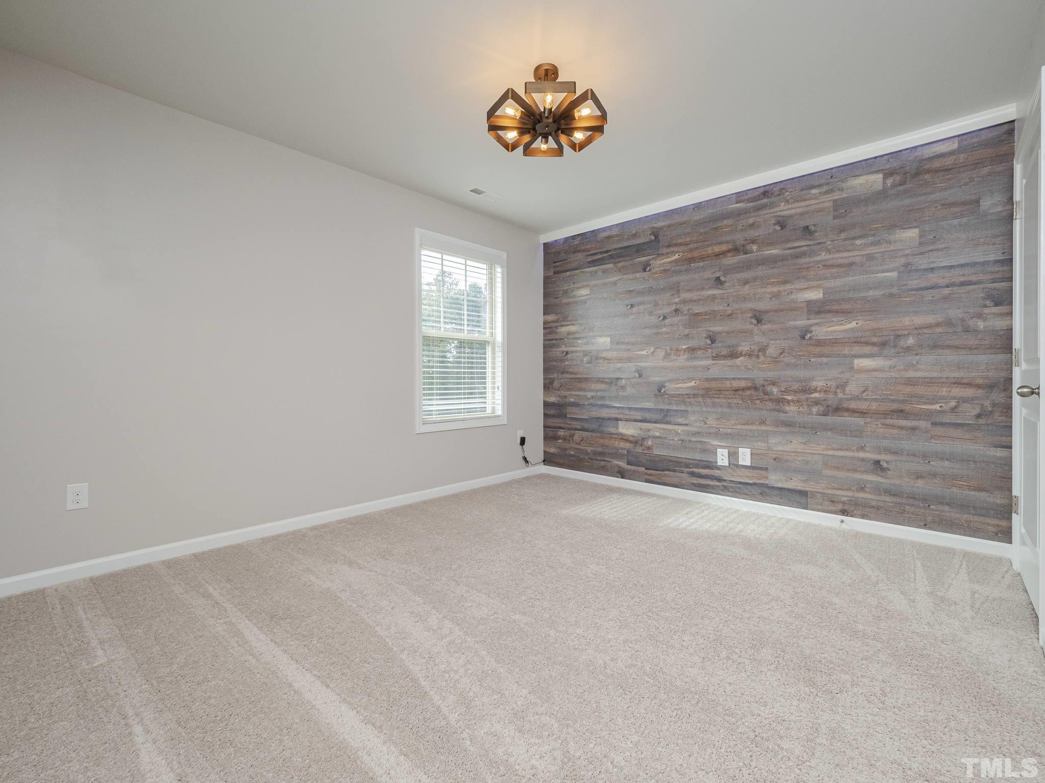 7435 Randshire Way Raleigh, NC 27616 - Photo 10 of 25 a view of an empty room with a window