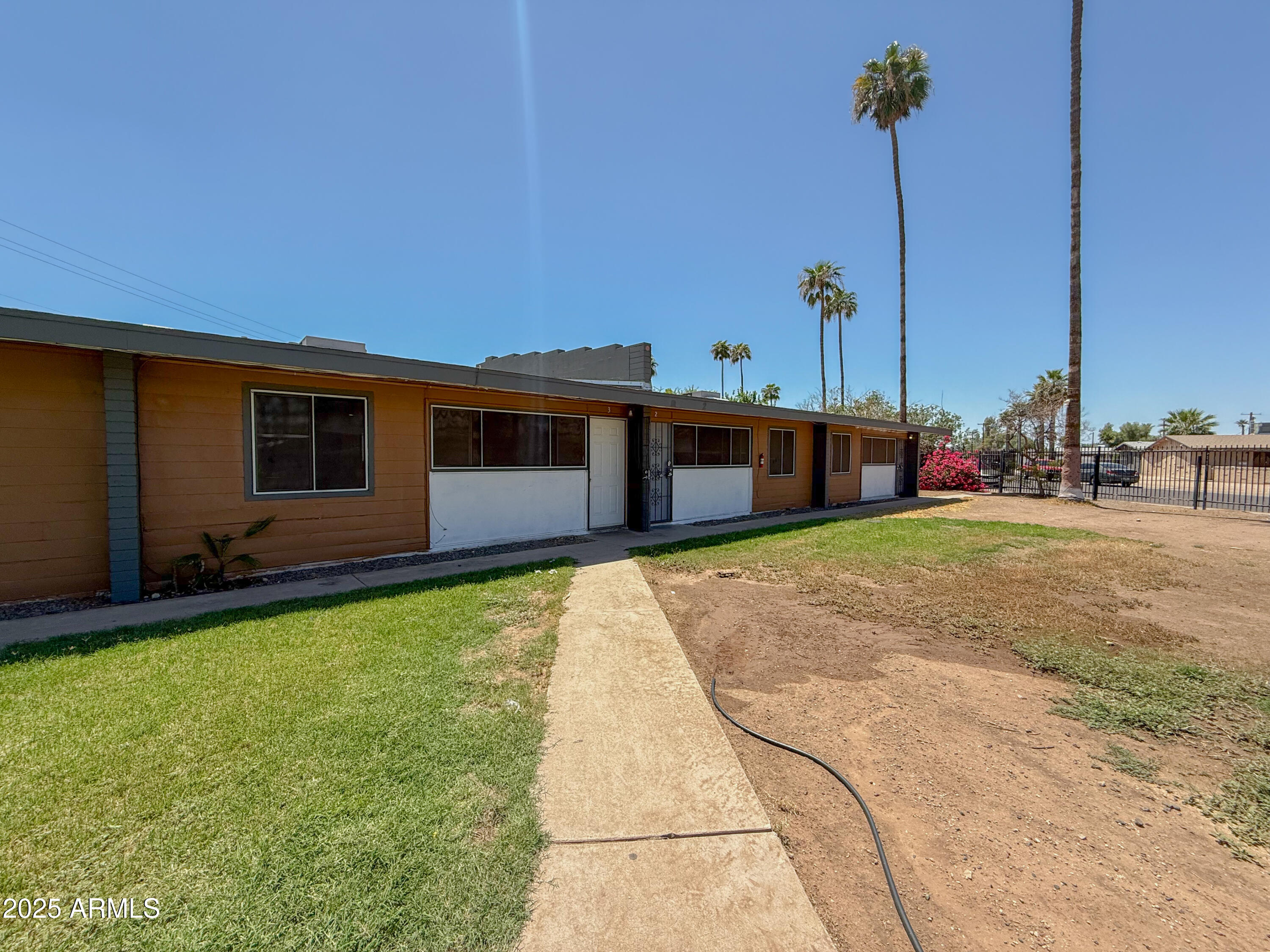 2139 West Devonshire Avenue, Unit 3 Phoenix, AZ 85015 - Photo 1 of 13 a view of a house with a backyard