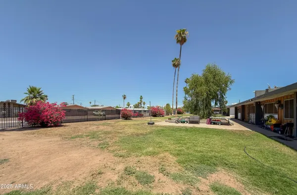 a view of a backyard with a house