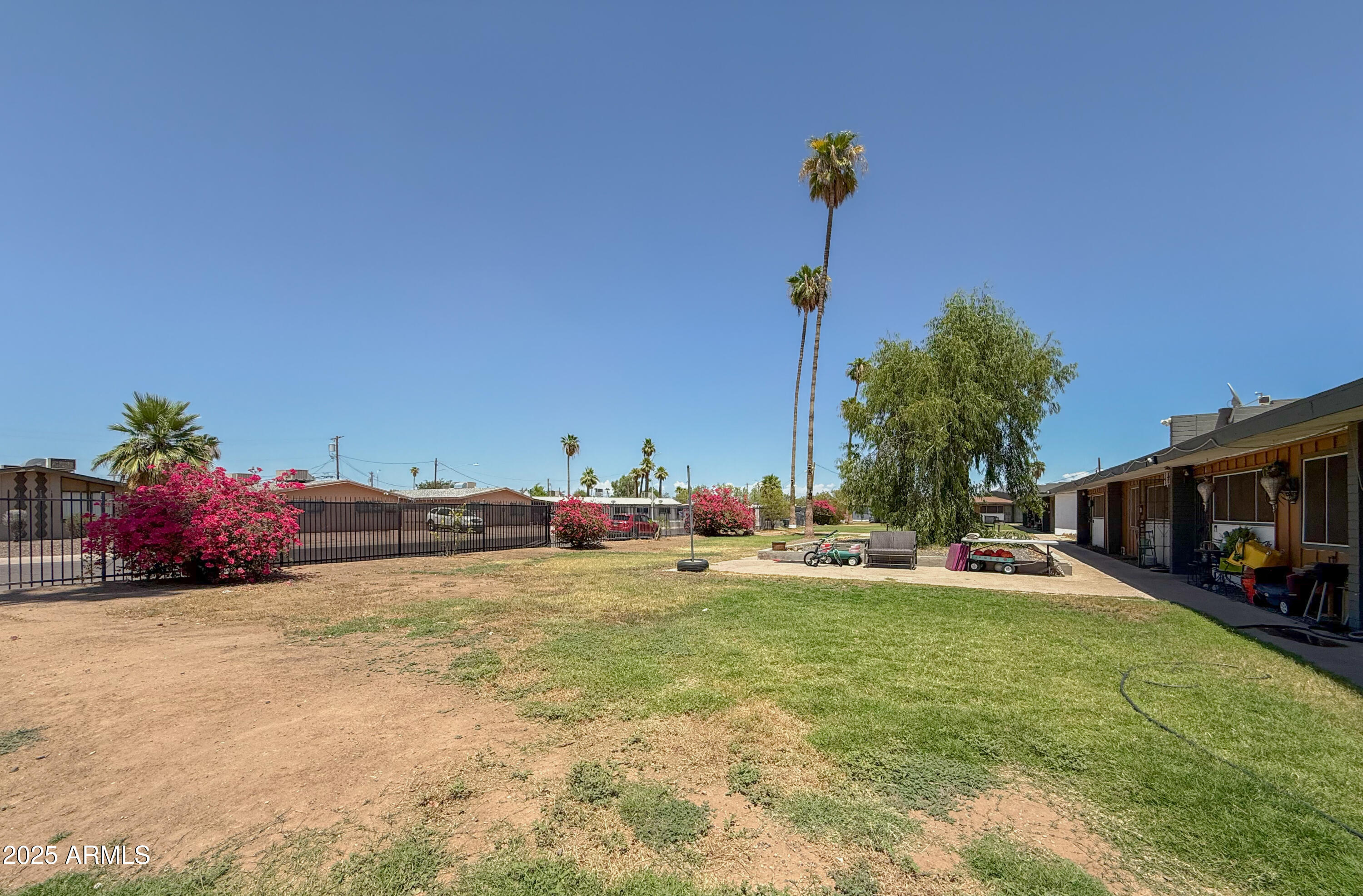 2139 West Devonshire Avenue, Unit 3 Phoenix, AZ 85015 - Photo 3 of 13 a view of a backyard with a house