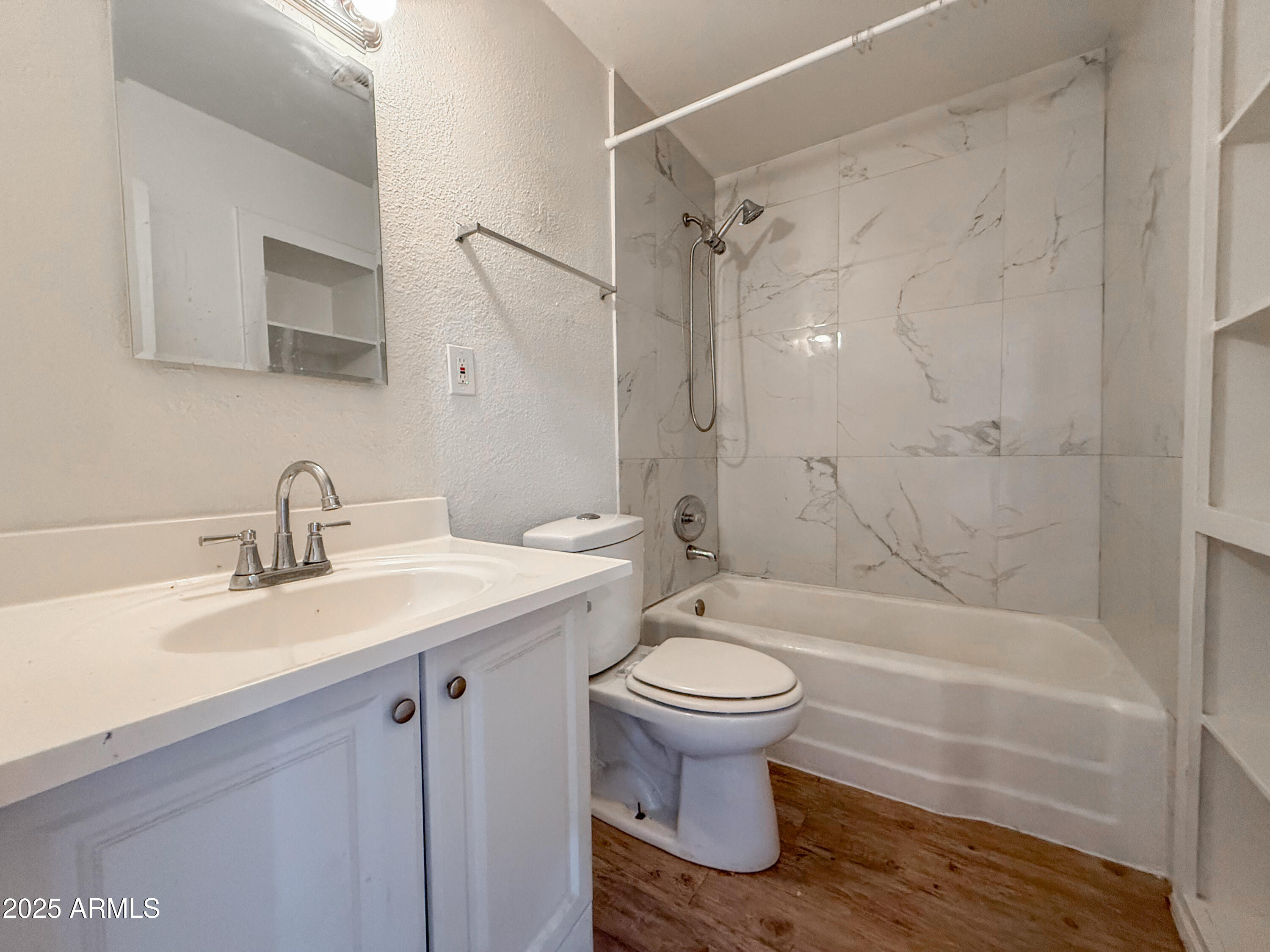 2139 West Devonshire Avenue, Unit 3 Phoenix, AZ 85015 - Photo 9 of 13 a bathroom with a sink toilet and shower