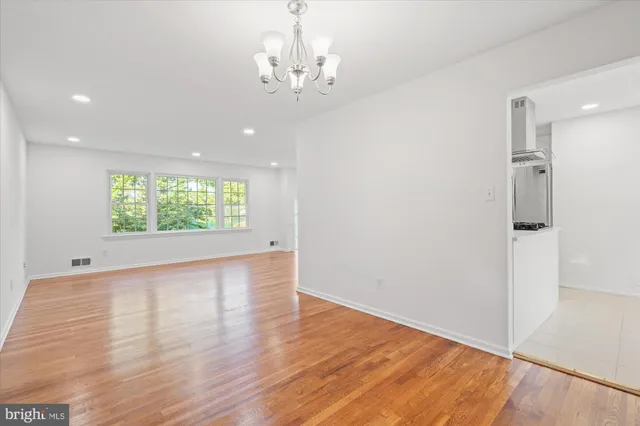 a view of hallway with wooden floor