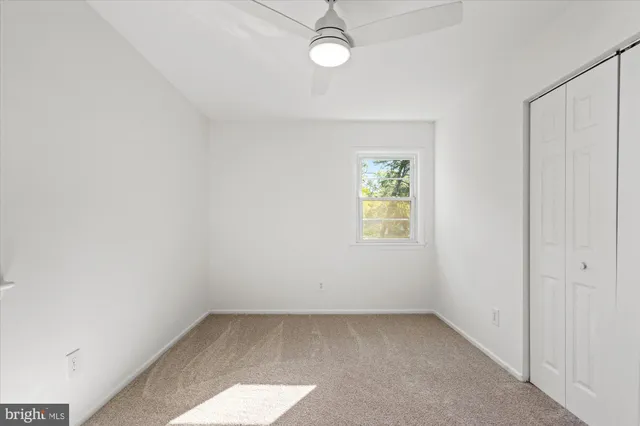 a view of an empty room and a window