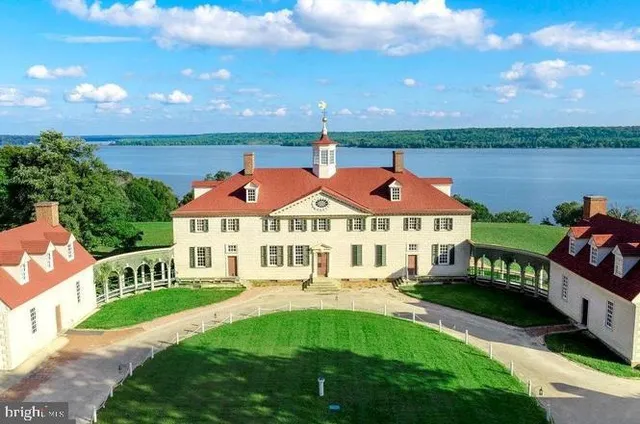 a view of a lake with boats and trees
