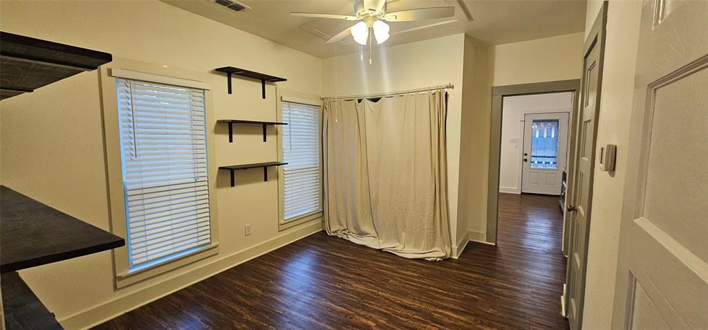 700 Live Oak Road Canton, TX 75103 - Photo 11 of 28 a view of a hallway with wooden floor and staircase