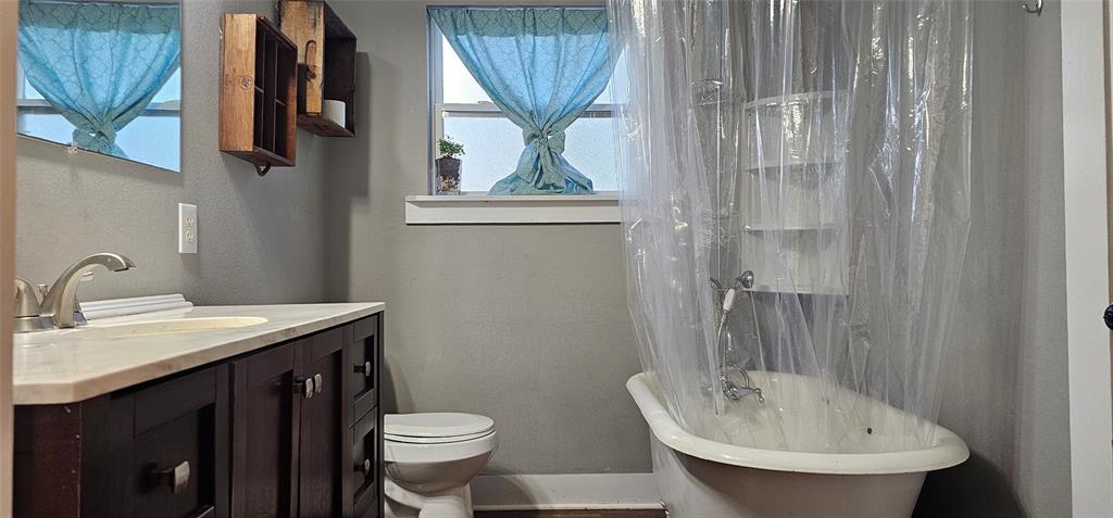 700 Live Oak Road Canton, TX 75103 - Photo 15 of 28 a bathroom with a sink a toilet and mirror