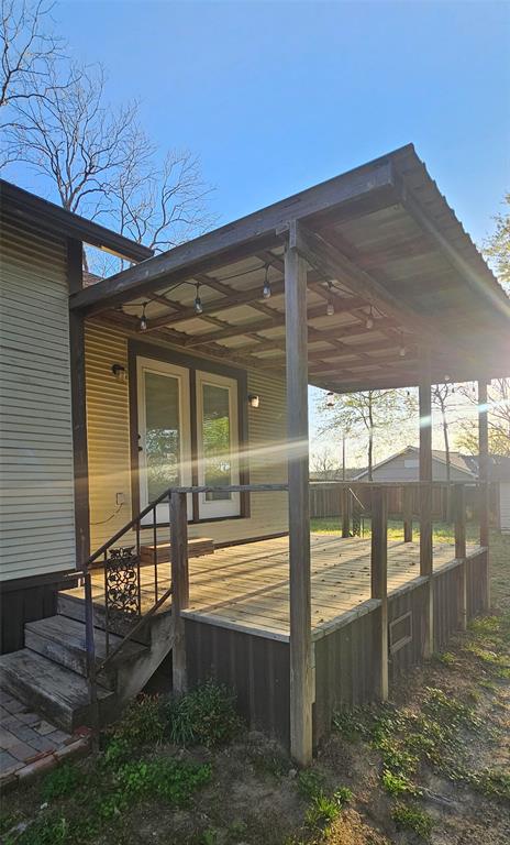 700 Live Oak Road Canton, TX 75103 - Photo 20 of 28 a view of a porch with a floor to ceiling window and floor