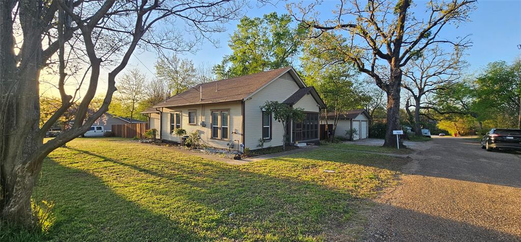 700 Live Oak Road Canton, TX 75103 - Photo 24 of 28 a view of a house with a tree in the yard