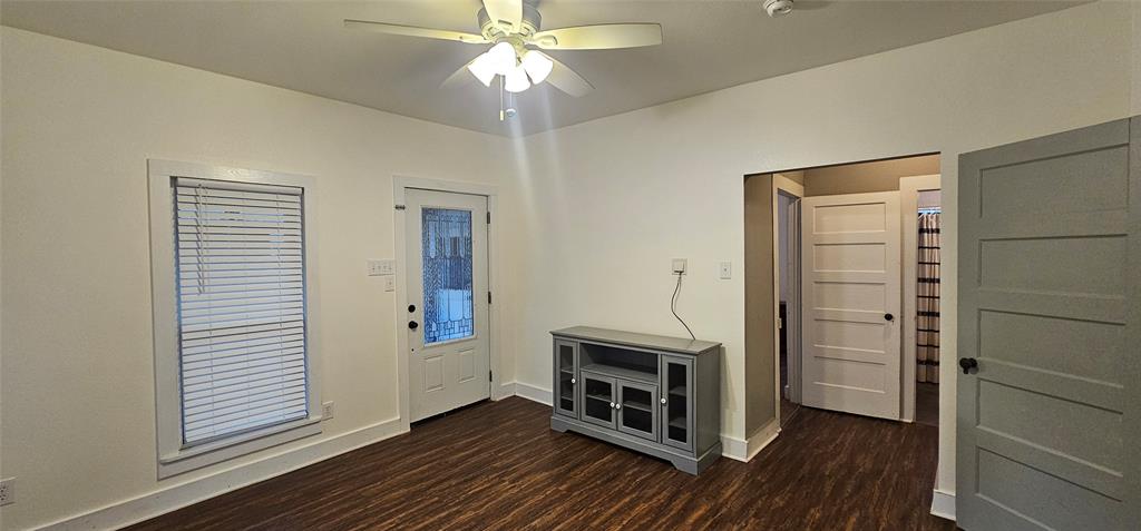 700 Live Oak Road Canton, TX 75103 - Photo 7 of 28 wooden floor in an empty room with a fireplace