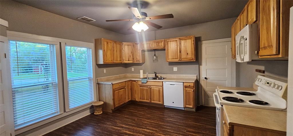700 Live Oak Road Canton, TX 75103 - Photo 8 of 28 a kitchen with stainless steel appliances granite countertop a stove and a sink