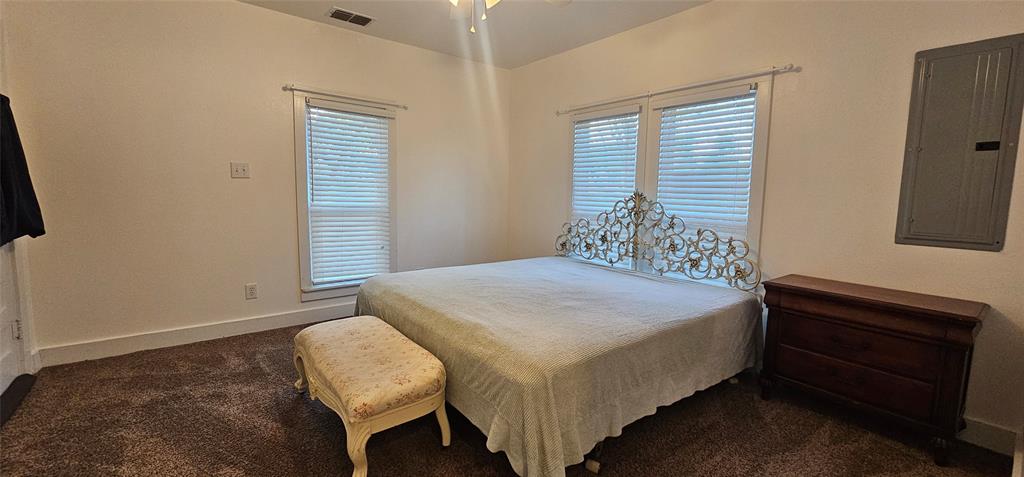 700 Live Oak Road Canton, TX 75103 - Photo 10 of 28 a bedroom with a bed and a window